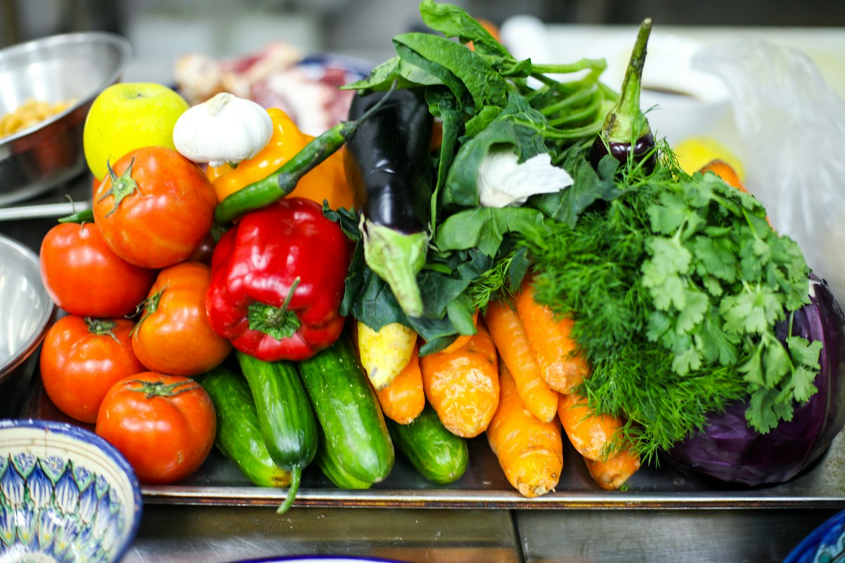 Farmer holding freshly harvested vegetables